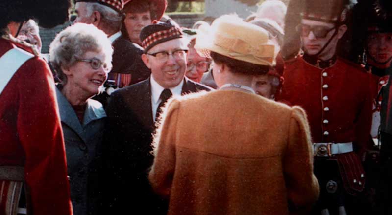 a photo George McLean meeting the Queen